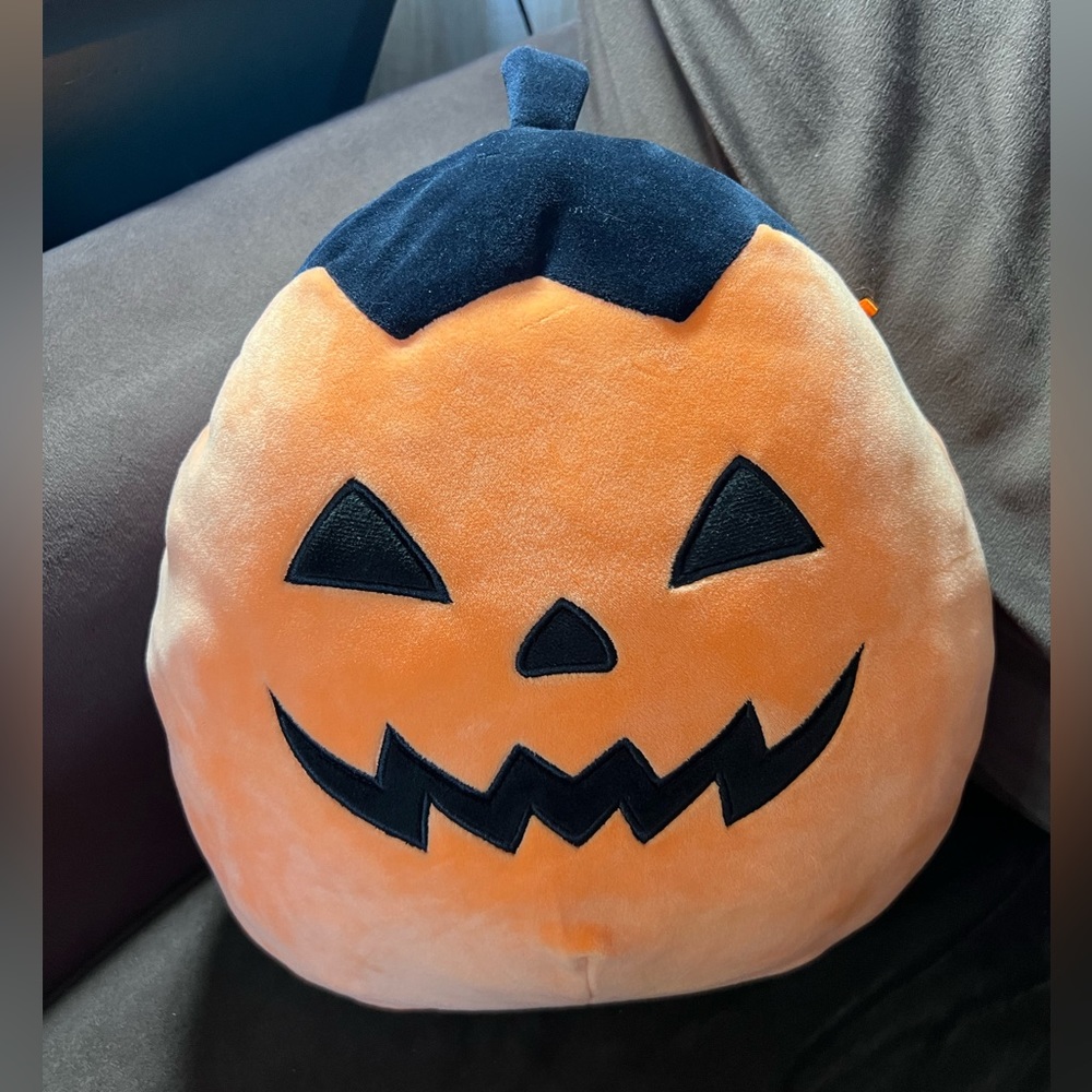 Squishmallow Halloween Jack o Latern with triangle eyes and black top